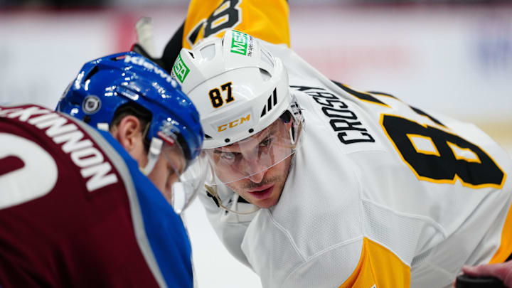 Mar 4, 2025; Denver, Colorado, USA; Pittsburgh Penguins center Sidney Crosby (87) and Colorado Avalanche center Nathan MacKinnon (29) wait for the puck to drop in the first period at Ball Arena. Mandatory Credit: Ron Chenoy-Imagn Images