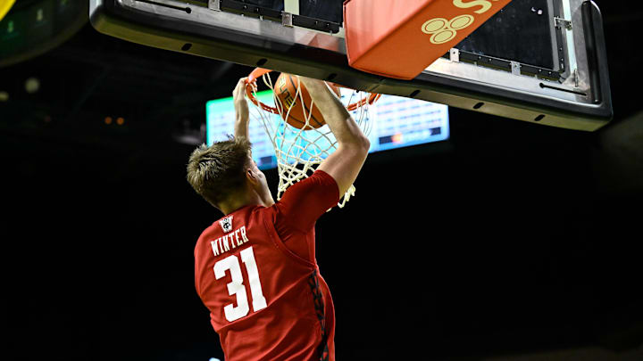 Feb 25, 2026; Eugene, Oregon, USA; Wisconsin Badgers forward Nolan Winter (31) dunks the ball during the second half against the Oregon Ducks at Matthew Knight Arena. Mandatory Credit: Craig Strobeck-Imagn Images