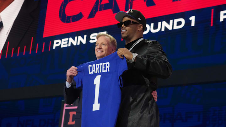 NFL commissioner Roger Goodell with Penn State Nittany Lions defensive end Abdul Carter after he is selected by the New York Giants as the No. 3 pick in the first round of the 2025 NFL Draft at Lambeau Field. 