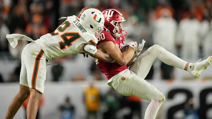 Indiana Hoosiers wide receiver Charlie Becker (80) makes a catch while being guarded by Miami (FL) Hurricanes defensive back Ethan O'Connor (24) on Monday, Jan. 19, 2026, during the College Football Playoff National Championship college football game at Hard Rock Stadium in Miami Gardens. Indiana Hoosiers wide receiver Charlie Becker (80) makes a catch while being guarded by Miami (FL) Hurricanes defensive back Ethan O'Connor (24) on Monday, Jan. 19, 2026, during the College Football Playoff National Championship college football game at Hard Rock Stadium in Miami Gardens.