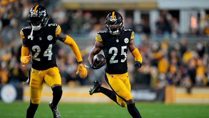 Pittsburgh Steelers safety Eric Rowe (25) runs back an intercepted pass in the second quarter of the NFL 16 game between the Pittsburgh Steelers and the Cincinnati Bengals at Acrisure Stadium in Pittsburgh on Saturday, Dec. 23, 2023. The Steelers led 24-0 at halftime.
