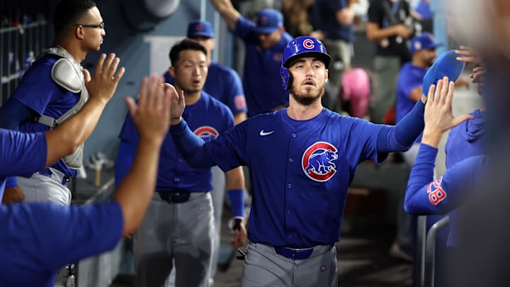 Sep 11, 2024; Los Angeles, California, USA; Chicago Cubs right fielder Cody Bellinger (24) is greeted in the dugout after scoring a run during the first inning against the Los Angeles Dodgers at Dodger Stadium. 