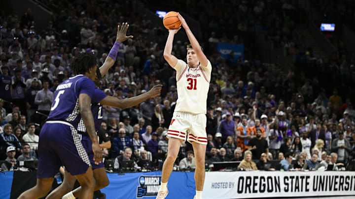 Mar 19, 2026; Portland, OR, USA; Wisconsin Badgers forward Nolan Winter (31) shoots against the High Point Panthers during the second half of a first round game of the men's 2026 NCAA Tournament at Moda Center. Mandatory Credit: Troy Wayrynen-Imagn Images