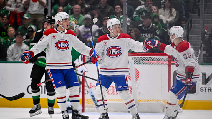 Jan 4, 2026; Dallas, Texas, USA; Montreal Canadiens left wing Juraj Slafkovsky (20) and center Oliver Kapanen (91) and right wing Ivan Demidov (93) celebrates a goal scored by Kapanen against the Dallas Stars during the second period at the American Airlines Center. Mandatory Credit: Jerome Miron-Imagn Images
