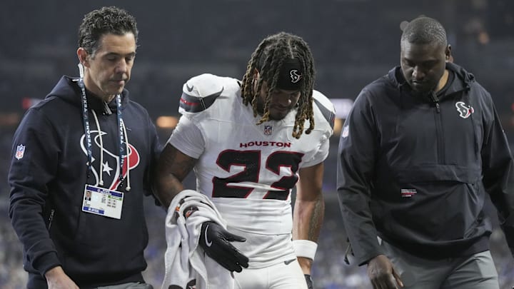 Nov 30, 2025; Indianapolis, Indiana, USA; Houston Texans safety Jaylen Reed (23) is helped off the field following an injury during a game against the Indianapolis Colts at Lucas Oil Stadium. Mandatory Credit: Grace Hollars-USA TODAY Network via Imagn Images Nov 30, 2025; Indianapolis, Indiana, USA; Houston Texans safety Jaylen Reed (23) is helped off the field following an injury during a game against the Indianapolis Colts at Lucas Oil Stadium. Mandatory Credit: Grace Hollars-USA TODAY Network via Imagn Images