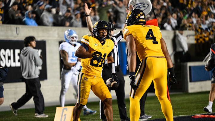 Oct 17, 2025; Berkeley, California, USA; California Golden Bears wide receiver Jacob De Jesus (21) celebrates with wide receiver Jordan King (4) after his touchdown against the North Carolina Tar Heels in the first quarter at California Memorial Stadium. Oct 17, 2025; Berkeley, California, USA; California Golden Bears wide receiver Jacob De Jesus (21) celebrates with wide receiver Jordan King (4) after his touchdown against the North Carolina Tar Heels in the first quarter at California Memorial Stadium.
