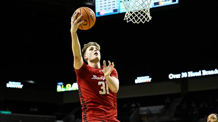 Feb 25, 2026; Eugene, Oregon, USA; Wisconsin Badgers forward Nolan Winter (31) scores during the second half against the Oregon Ducks at Matthew Knight Arena. Mandatory Credit: Craig Strobeck-Imagn Images