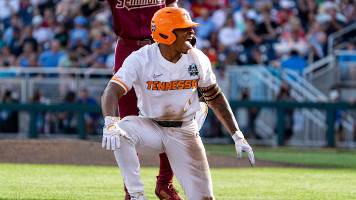 Jun 14, 2024; Omaha, NE, USA; Tennessee Volunteers second baseman Christian Moore (1) celebrates after hitting a triple against the Florida State Seminoles during the first inning at Charles Schwab Filed Omaha. Mandatory Credit: Dylan Widger-USA TODAY Sports