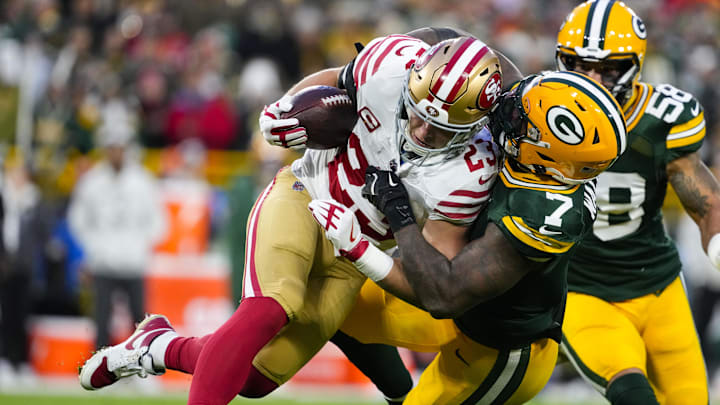 Nov 24, 2024; Green Bay, Wisconsin, USA; San Francisco 49ers running back Christian McCaffrey (23) is tackled by Green Bay Packers linebacker Quay Walker (7) during the second quarter at Lambeau Field. Mandatory Credit: Jeff Hanisch-Imagn Images Nov 24, 2024; Green Bay, Wisconsin, USA; San Francisco 49ers running back Christian McCaffrey (23) is tackled by Green Bay Packers linebacker Quay Walker (7) during the second quarter at Lambeau Field. Mandatory Credit: Jeff Hanisch-Imagn Images