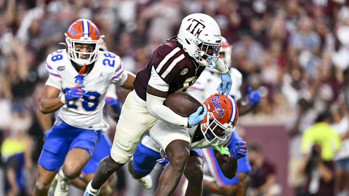 Oct 11, 2025; College Station, Texas, USA; Texas A&M Aggies running back Le'Veon Moss (8) runs the ball in for a touchdown during the second quarter against the Florida Gators at Kyle Field. Mandatory Credit: Maria Lysaker-Imagn Images 