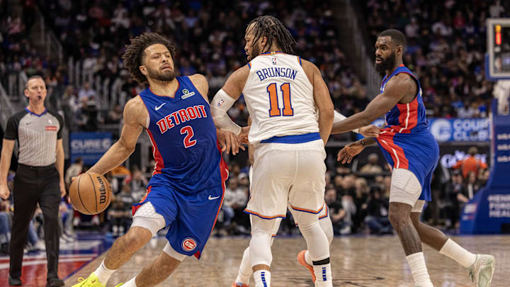 Apr 10, 2025; Detroit, Michigan, USA; New York Knicks guard Jalen Brunson (11) defends against Detroit Pistons guard Cade Cunningham (2) during the second half at Little Caesars Arena. Mandatory Credit: David Reginek-Imagn Images