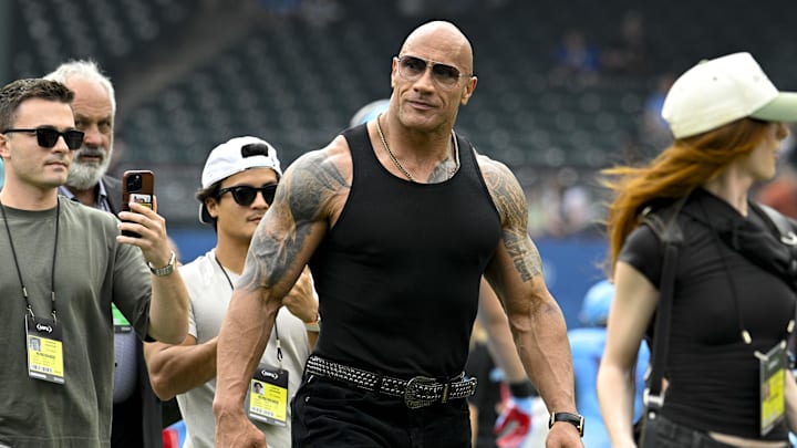 Mar 30, 2024; Arlington, TX, USA; UFL owner Dwayne Johnson aka The Rock walks off the field before the game between the Arlington Renegades and the Birmingham Stallions at Choctaw Stadium. 