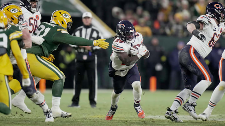 Chicago Bears running back Kyle Monangai (25) runs past Green Bay Packers defensive tackle Warren Brinson (91) during the second quarter of their game Sunday, December 7, 2025 at Lambeau Field in Green Bay, Wisconsin. Chicago Bears running back Kyle Monangai (25) runs past Green Bay Packers defensive tackle Warren Brinson (91) during the second quarter of their game Sunday, December 7, 2025 at Lambeau Field in Green Bay, Wisconsin.