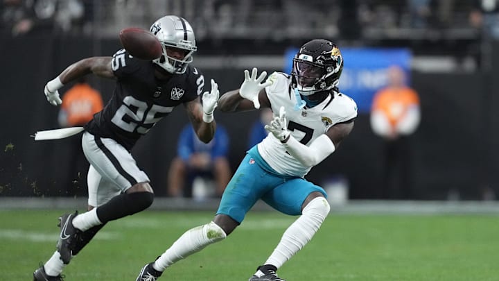 Dec 22, 2024; Paradise, Nevada, USA;Jacksonville Jaguars wide receiver Brian Thomas Jr. (7) makes a catch against Las Vegas Raiders cornerback Decamerion Richardson (25) in the first half at Allegiant Stadium. Mandatory Credit: Kirby Lee-Imagn Images Dec 22, 2024; Paradise, Nevada, USA;Jacksonville Jaguars wide receiver Brian Thomas Jr. (7) makes a catch against Las Vegas Raiders cornerback Decamerion Richardson (25) in the first half at Allegiant Stadium. Mandatory Credit: Kirby Lee-Imagn Images
