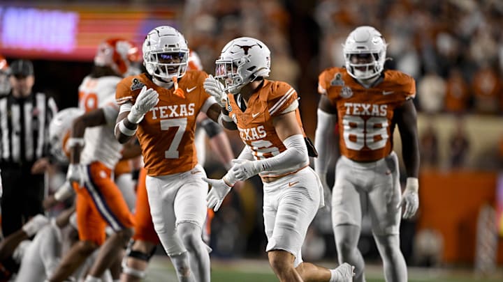 Dec 21, 2024; Austin, Texas, USA; Texas Longhorns defensive back Jahdae Barron (7) and defensive back Michael Taaffe (16) in action during the game between the Texas Longhorns and the Clemson Tigers in the CFP National Playoff First Round at Darrell K Royal-Texas Memorial Stadium. Mandatory Credit: Jerome Miron-Imagn Images