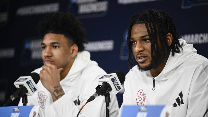 Mar 19, 2026; San Diego, CA, USA; St. John's basketball forward Zuby Ejiofor (24), right, speaks at a press conference as forward Dillon Mitchell (1) looks on ahead of the first round of the men's 2026 NCAA Tournament at Viejas Arena. Mar 19, 2026; San Diego, CA, USA; St. John's basketball forward Zuby Ejiofor (24), right, speaks at a press conference as forward Dillon Mitchell (1) looks on ahead of the first round of the men's 2026 NCAA Tournament at Viejas Arena.