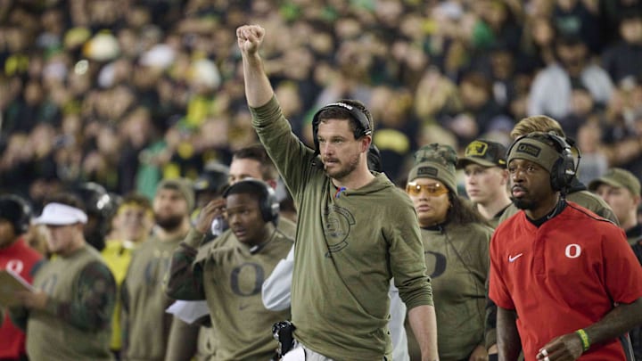 Nov 11, 2023; Eugene, Oregon, USA; Oregon Ducks head coach Dan Lanning signals to his defense during the first half against the USC Trojans at Autzen Stadium. Mandatory Credit: Troy Wayrynen-Imagn Images