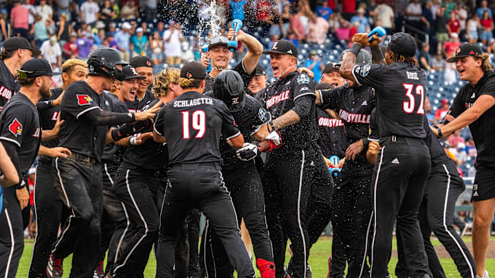 Jun 17, 2025; Omaha, Neb, USA; The Louisville Cardinals celebrate after defeating the Oregon State Beavers at Charles Schwab Field. Mandatory Credit: Dylan Widger-Imagn Images