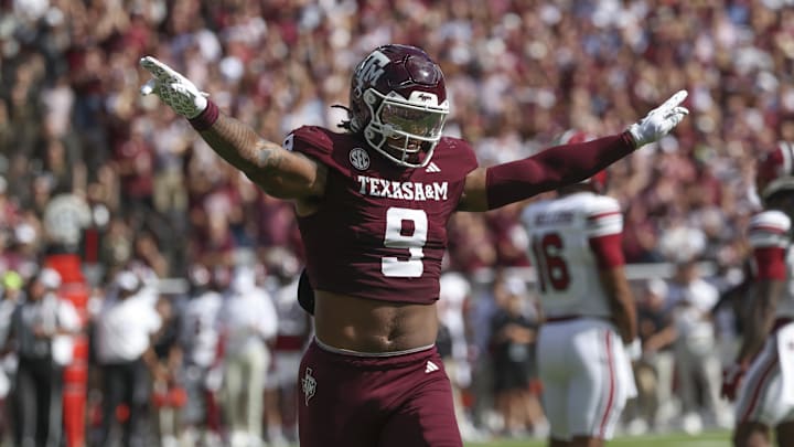 Nov 15, 2025; College Station, Texas, USA; Texas A&M Aggies defensive end Cashius Howell (9) reacts after a defensive play during the first quarter against the South Carolina Gamecocks at Kyle Field. Mandatory Credit: Troy Taormina-Imagn Images