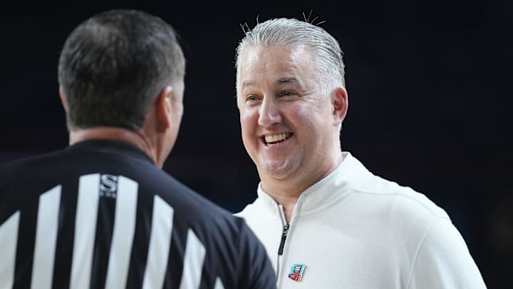 Purdue Boilermakers head coach Matt Painter talks to an official Purdue Boilermakers head coach Matt Painter talks to an official