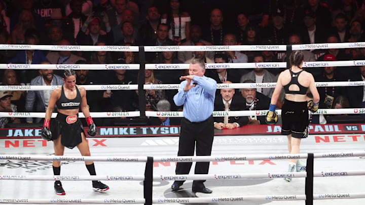 Amanda Serrano (red gloves) fights Katie Taylor (blue gloves) at AT&T Stadium on November 15, 2024. 