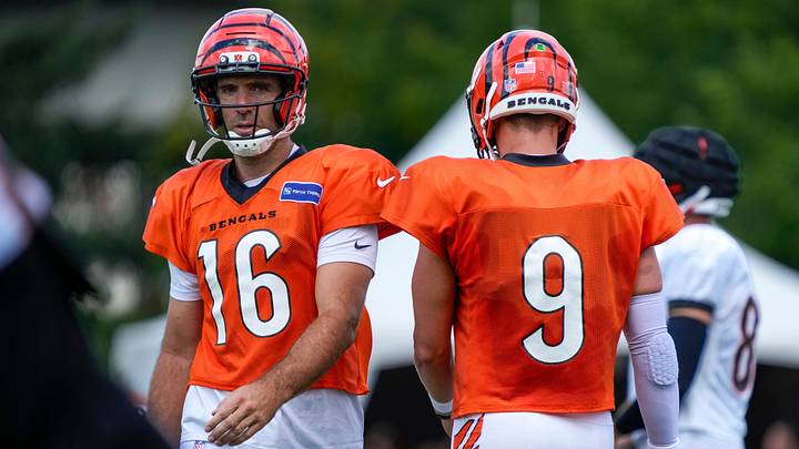 Cincinnati Bengals quarterback Joe Flacco (16) and quarterback Joe Burrow (9) swap spots between throws during practice at the Paycor Stadium practice facility in downtown Cincinnati on Monday, Aug. 3, 2026.