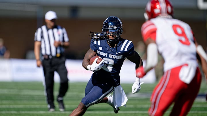 Sep 14, 2024; Logan, Utah, USA; Utah State Aggies running back Rahsul Faison (3) runs with the ball against the Utah Utes at Merlin Olsen Field at Maverik Stadium. Mandatory Credit: Jamie Sabau-Imagn Images Sep 14, 2024; Logan, Utah, USA; Utah State Aggies running back Rahsul Faison (3) runs with the ball against the Utah Utes at Merlin Olsen Field at Maverik Stadium. Mandatory Credit: Jamie Sabau-Imagn Images