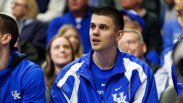 Dec 14, 2024; Lexington, Kentucky, USA; Kentucky Wildcats guard Kerr Kriisa watches the action from the bench during the second half against the Louisville Cardinals at Rupp Arena at Central Bank Center. Mandatory Credit: Jordan Prather-Imagn Images