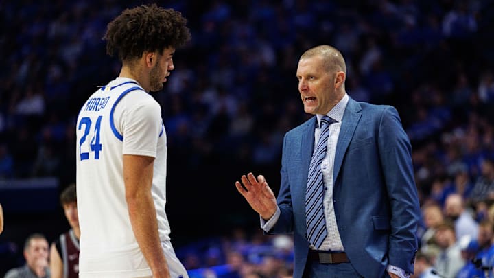 Dec 23, 2025; Lexington, Kentucky, USA; Kentucky Wildcats head coach Mark Pope talks with center Malachi Moreno (24) during the second half against the Bellarmine Knights at Rupp Arena at Central Bank Center. Mandatory Credit: Jordan Prather-Imagn Images