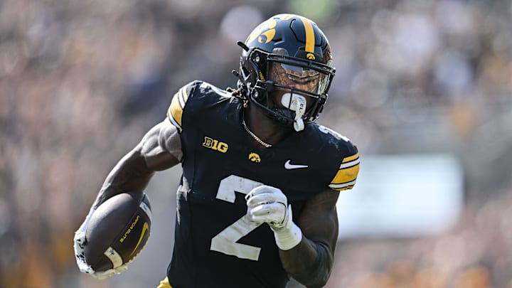 Oct 12, 2024; Iowa City, Iowa, USA; Iowa Hawkeyes running back Kaleb Johnson (2) runs for a 17 yard touchdown run during the second quarter against the Washington Huskies at Kinnick Stadium.
