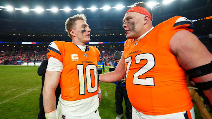 Denver Broncos quarterback Bo Nix and offensive tackle Garett Bolles celebrate after a win against the Buffalo Bills.