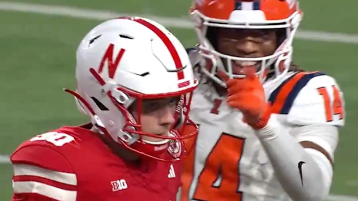 Illinois defensive back Xavier Scott (#14) wags his finger at Nebraska kicker John Hohl (#90) after a missed field goal during the fourth quarter of the Fighting Illini's win over the Cornhuskers on Friday. 