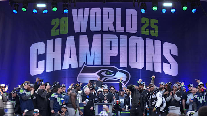 Feb 11, 2026; Seattle, WA, USA; Seattle Seahawks linebacker Ernest Jones IV (13) speaks during the Super Bowl LX trophy celebration at Lumen Field. Mandatory Credit: Kirby Lee-Imagn Images