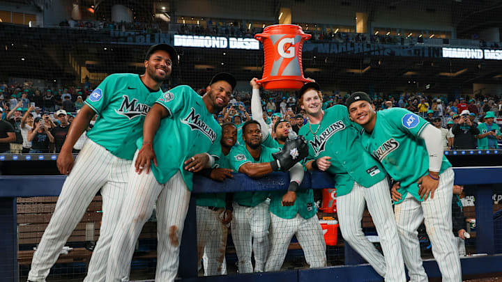 Miami Marlins right fielder Owen Caissie (17) poses for a photo with pitcher Michael Petersen (49), first baseman Deyvison de Los Santos (63), second baseman Xavier Edwards (9), shortstop Otto Lopez (6), catcher Agustin Ramirez (50), and third baseman Javier Sanoja (8) after hitting a two-run walk-off home run against the Colorado Rockies during the ninth inning at loanDepot Park. 