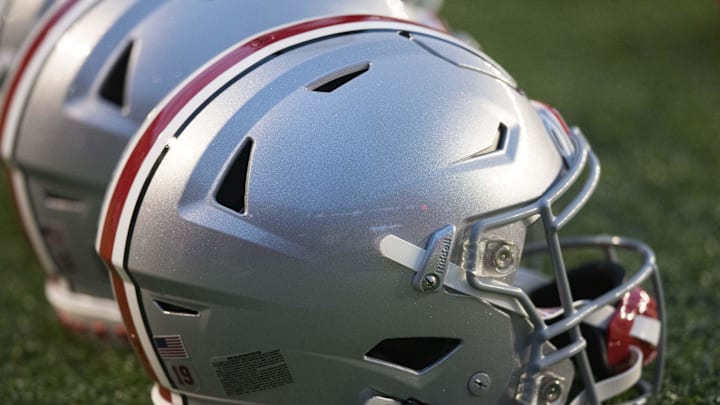 Oct 28, 2023; Madison, Wisconsin, USA;  Ohio State Buckeyes helmets sit on the field during warmups
