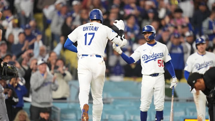 Apr 14, 2025; Los Angeles, California, USA; Los Angeles Dodgers shortstop Mookie Betts (50) congratulates designated hitter Shohei Ohtani (17) after he hit a home run in the bottom of the third inning against the Colorado Rockies at Dodger Stadium. Mandatory Credit: Kirby Lee-Imagn Images