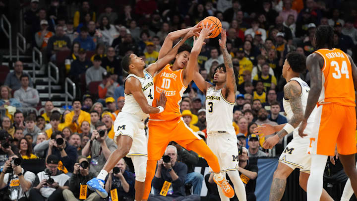 Mar 29, 2026; Chicago, IL, USA; Tennessee Volunteers forward Nate Ament (10) is double teamed by Michigan Wolverines guard Nimari Burnett (4) and guard Elliot Cadeau (3) in the first half during an Elite Eight game of the Midwest Regional of the men's 2026 NCAA Tournament at United Center. Mandatory Credit: David Banks-Imagn Images