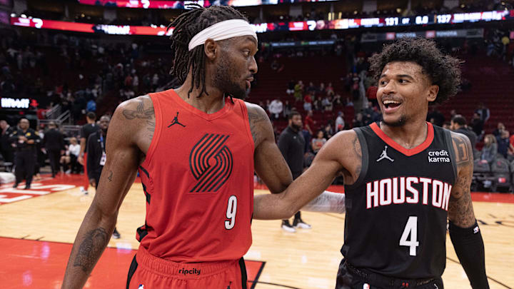 Jan 24, 2024; Houston, Texas, USA; Portland Trail Blazers forward Jerami Grant (9) hugs Houston Rockets guard Jalen Green (4) after their game at Toyota Center. Mandatory Credit: Thomas Shea-Imagn Images
