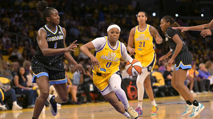 Jun 29, 2025; Los Angeles, California, USA; Los Angeles Sparks guard Odyssey Sims (0) drives past Chicago Sky center Elizabeth Williams (1) in the first half at Crypto.com Arena. Mandatory Credit: Jayne Kamin-Oncea-Imagn Images