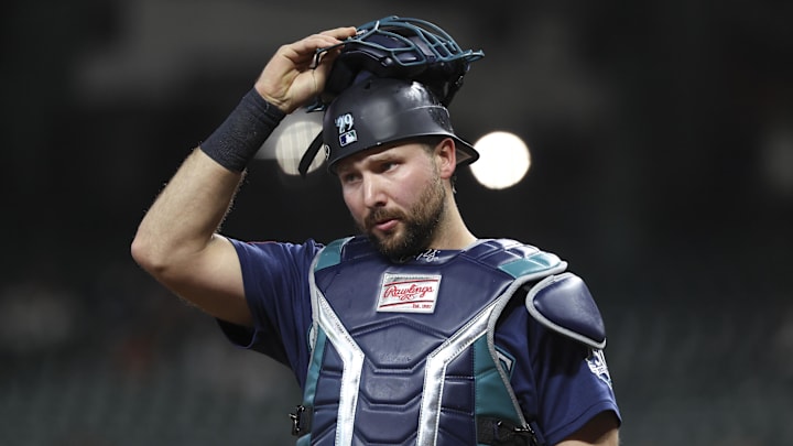 May 11, 2026; Houston, Texas, USA; Seattle Mariners catcher Cal Raleigh (29) puts on his mask after a play during the second inning against the Houston Astros at Daikin Park. 