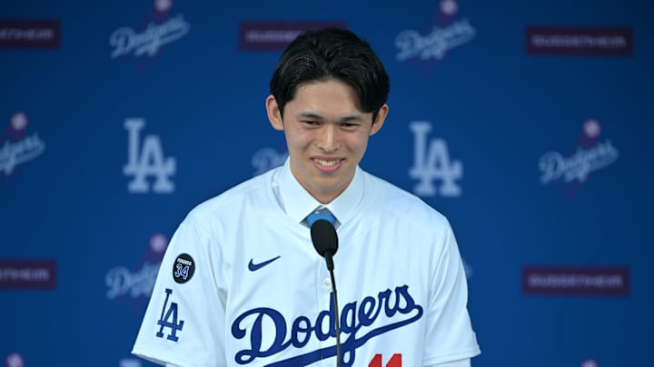 Jan 22, 2025; Los Angeles, CA, USA;  Los Angeles Dodgers pitcher Roki Sasaki (11) speaks during an introductory press conference at Dodger Stadium. Mandatory Credit: Jayne Kamin-Oncea-Imagn Images  