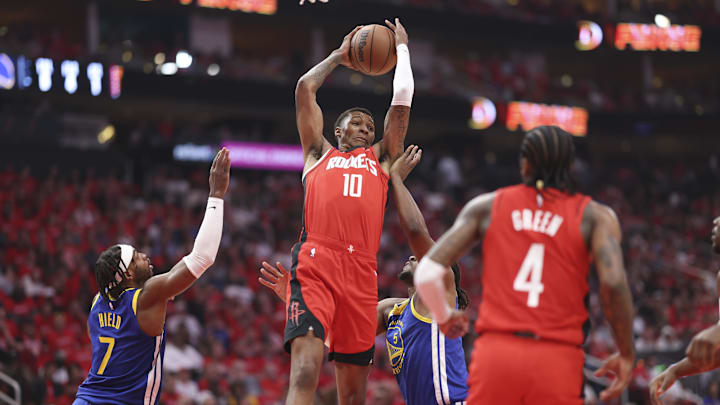 Apr 23, 2025; Houston, Texas, USA; Houston Rockets forward Jabari Smith Jr. (10) grabs a rebound during the first quarter during game two of the first round for the 2024 NBA Playoffs against the Golden State Warriors at Toyota Center. Mandatory Credit: Troy Taormina-Imagn Images