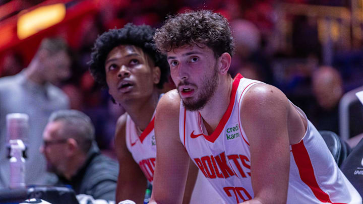 Jan 12, 2024; Detroit, Michigan, USA; Houston Rockets center Alperen Sengun (28) and forward Amen Thompson (1) sit on the sidelines on a play stoppage against the Detroit Pistons during the in the first half at Little Caesars Arena. Mandatory Credit: David Reginek-Imagn Images
