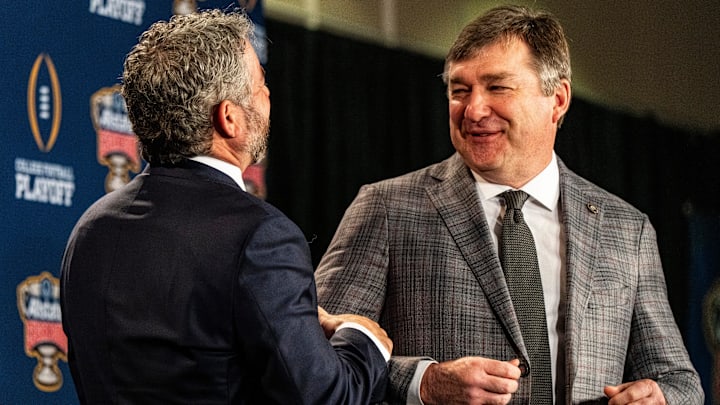 Ole Miss head coach Pete Golding and Georgia head coach Kirby Smart share a laugh after posing for pictures during a press conference for the Sugar Bowl and College Football Playoff quarterfinals at the Sheraton New Orleans Hotel in New Orleans, La., on Wednesday, Dec. 31, 2025.