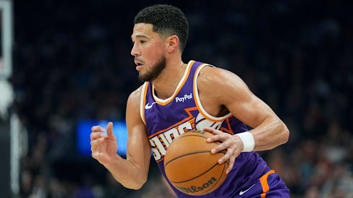 Jan 2, 2026; Phoenix, Arizona, USA; Phoenix Suns guard Devin Booker (1) dribbles against the Sacramento Kings during the first half at Mortgage Matchup Center. Mandatory Credit: Joe Camporeale-Imagn Images