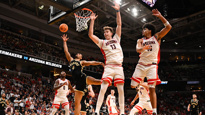 Mar 28, 2026; San Jose, CA, USA; Purdue Boilermakers forward Trey Kaufman-Renn (4) shoots the ball defended by center Motiejus Krivas (13) and forward Koa Peat (10) in the second half during an Elite Eight game of the West Regional of the men's 2026 NCAA Tournament at SAP Center. Mandatory Credit: Eakin Howard-Imagn Images