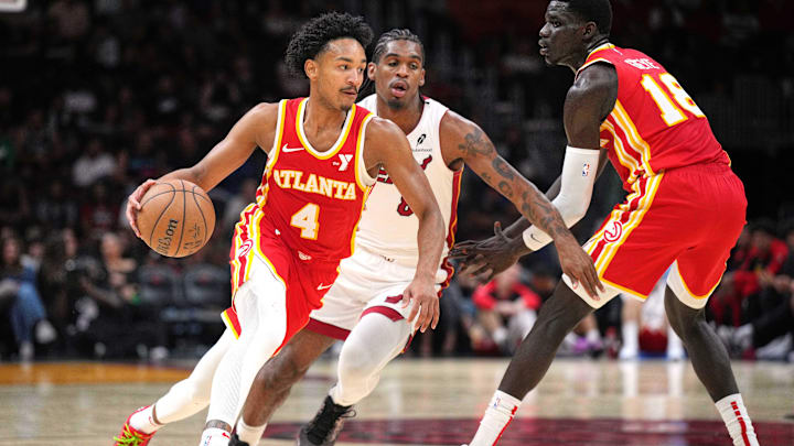 Oct 16, 2024; Miami, Florida, USA; Atlanta Hawks guard Kobe Bufkin (4) brings the ball up the court against the Miami Heat in the second half at Kaseya Center. Mandatory Credit: Jim Rassol-Imagn Images