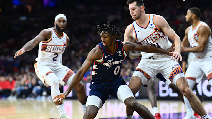 Nov 4, 2023; Philadelphia, Pennsylvania, USA; Philadelphia 76ers guard Tyrese Maxey (0) reaches for the ball against Phoenix Suns forward Drew Eubanks (14) in the fourth quarter at Wells Fargo Center. Mandatory Credit: Kyle Ross-Imagn Images