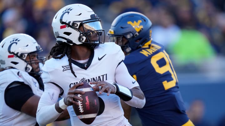 Cincinnati Bearcats quarterback Emory Jones (5) throws in the second quarter during an NCAA college football game between the Cincinnati Bearcats and the West Virginia Mountaineers, Saturday, Nov. 18, 2023, at Milan Puskar Stadium in Morgantown, W. Va.