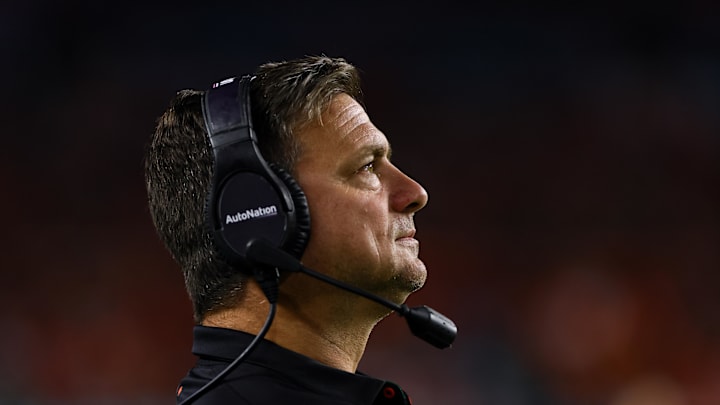 Oct 26, 2024; Miami Gardens, Florida, USA; Miami Hurricanes offensive coordinator Shannon Dawson watches from the sideline before the game against the Florida State Seminoles at Hard Rock Stadium. Mandatory Credit: Sam Navarro-Imagn Imagesa